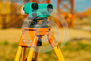 Close up view on old theodolite on construction place