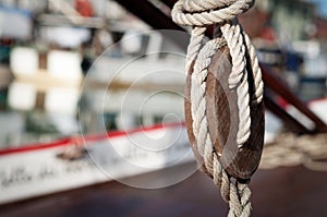Close up view of a old vintage pulley system with rigging ropes