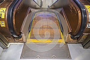 Close up view of old wooden escalator stairs down in department store.