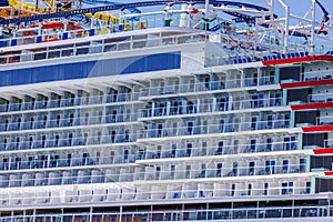 Close-up view of a ?olorful multi-deck cruise liner.