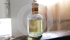 close up view of an oud attar oil glass bottle