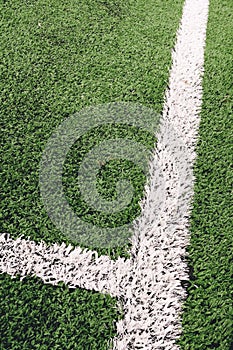 Close Up View of Out of Bounds Lines on Green Artificial Turf