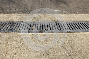 Close up view of outdoor sewer grate for water drainage isolated.