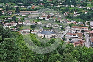 Close-up view over La Bresse with focus on the church and cemetery