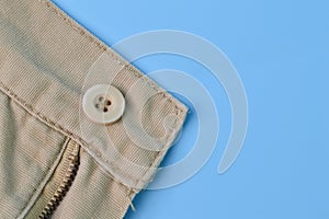Close up view of pant button. Clothes accessory