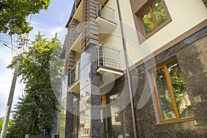 Close up view of part of a building facade with the surface of granite wall. Natural stone materials