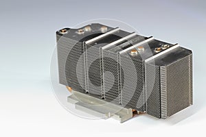A close up view of passive CPU cooler with the aluminum fin and copper heat pipe structure