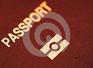 A close up view of Passport text and e-passport sig on a red passport