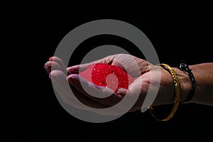 Close-up view of people holding colorful powder in hands at holi festival