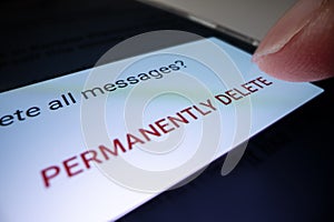 Close-up view of permanently deleting junk email on a smartphone photo