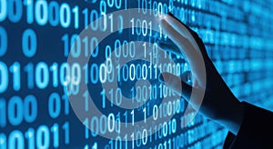 A human hand interacting with a glowing blue digital display of binary code and data streams