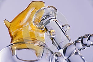 Close up view of a piece of cannabis oil concentrate aka shatter