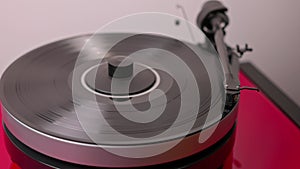 Close-up view of playing analog vinyl record on Hi-Fi turntable
