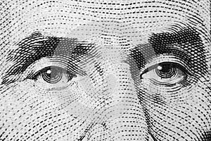 Close up view Portrait of Abraham Lincoln on the one five dollar bill. Background of the money. 5 dollar bill with Abraham Lincoln