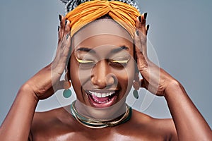 Close up view portrait of happy cute young beautiful woman taken aback in disbelief hands on face isolated gray background photo