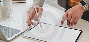 Close-up view of professional businessman writing his idea on blank screen laptop computer