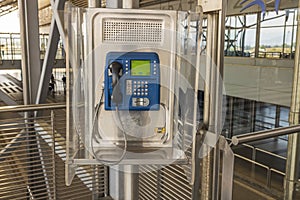 Close up view of public payphone at airport. Communication concept. Greece.