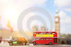 Close-up view of public transport figurines with Big Ben in the background