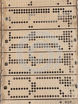 Close up of punched cards on old working hand weaving loom