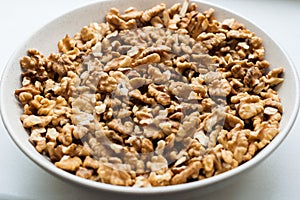 Close-up view of purified walnut in the white plate