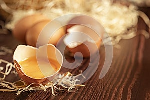 Close-up view of raw chicken eggs on wooden background. Fresh farm egg. Eggs in carton box.