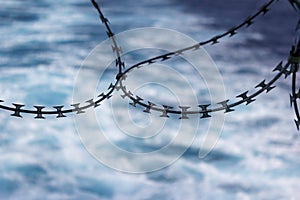 Close up view of razor wire fortification at ship\'s stern. Anti piracy protection. HRA, High Risk Areas.