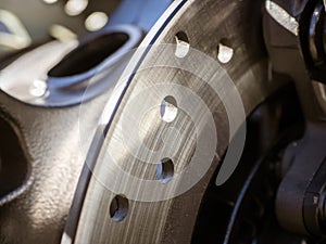 Close-up view of rear ventilated disc breaks of motorcycle.