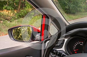 Close-up view of rearview mirror on the car