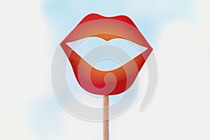 close up view of a red paper lips photo booth props