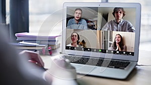 Close up view of remote employee conferencing in online group virtual chat on laptop screen. Company staff colleagues