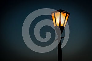 Close up view of a retro srteet lantern in the evening photo
