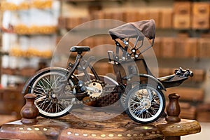 Close-up view of a retro trishaw for sale at the souvenir shop