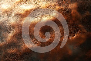 A close-up view of rich copper-toned leather showcasing its smooth, glossy surface with subtle color and texture variations