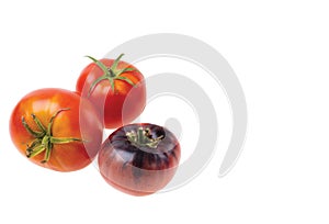 Close up view of ripe red tomatoes isolated on white background.