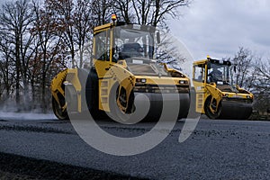 Close up view of a road roller working on a new road construction site.