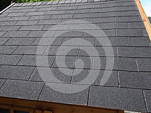 Close up view of a roof with  bitumen shingles