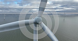 Close up view of the rotor blades of an Offshore wind turbine wind park. The Netherlands.