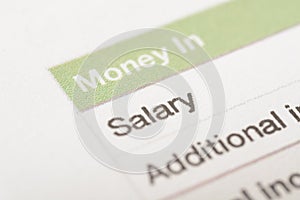 A close-up view of SALARY word displayed on the paper