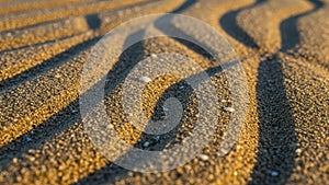 Close up view of sand with wavy patterns creating a textured