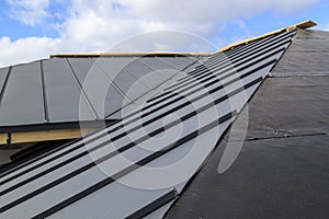 close-up view of seam roof under construction on waterproofing layer