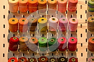 Close up view of a set of sewing threads. Multi-colored thread.