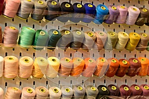 Close up view of a set of sewing threads. Multi-colored thread.