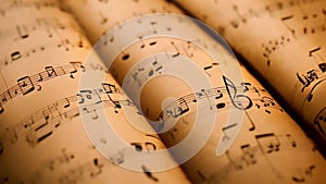 a close-up view of sheet music, showcasing the intricate arrangement of musical notes and symbols, Atmospheric music background