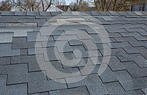 A close up view of shingles a roof damage. Roof Shingles - Roofing.