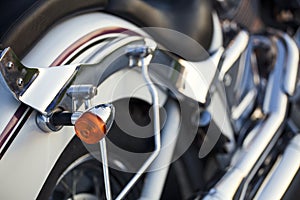 Close up view of a shiny chrome motorcycle design engine with bl