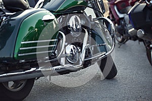 Close up view of a shiny chrome motorcycle design engine with ex