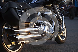 Close up view of a shiny chrome motorcycle design engine with ex