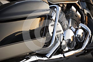 Close up view of a shiny chrome motorcycle design engine with ex