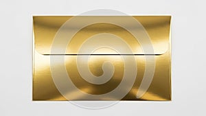 A close-up view of a shiny, reflective gold-colored rectangular object