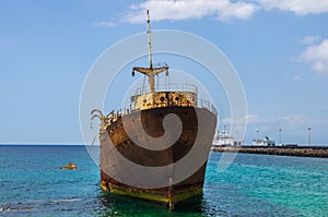 Close up view of ship wreck of Temple Hall with the Port of Arrecife in background